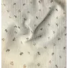 Double gaze de coton organique imprimée  fond écru, imprimé petites baies camel et gris